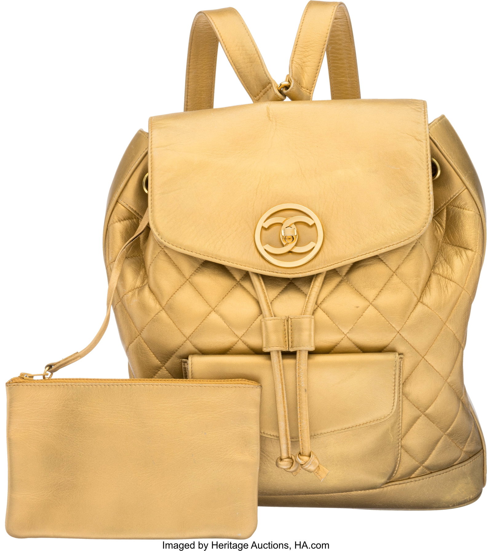 Chanel Vintage Gold Metallic Quilted Leather Vin: Chanel Vintage Gold Metallic Quilted Leather Vintage Duma Backpack with Gold Hardware 1991-1994 Condition: 3 11.5" Width x 12" Height x 3.5" Depth This bag is done in Gold