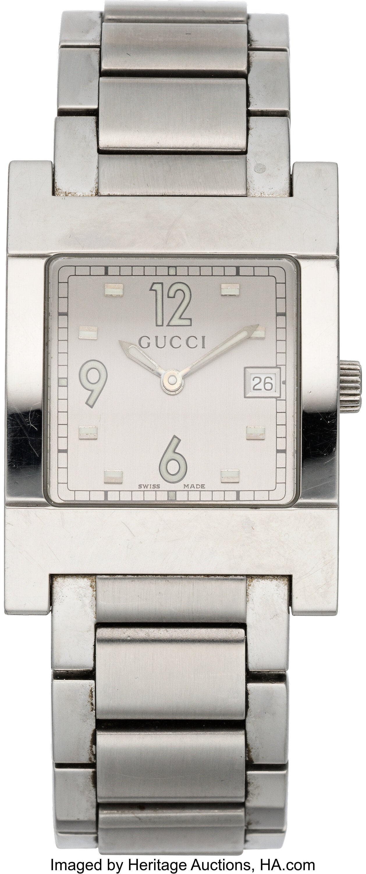 Gucci Stainless Steel 7700 Series Watch Conditio: Gucci Stainless Steel 7700 Series Watch Condition: 2 1" Width, 6.5" Length This watch is done in Stainless Steel, featuring a white dial and a butterfly clasp. There is