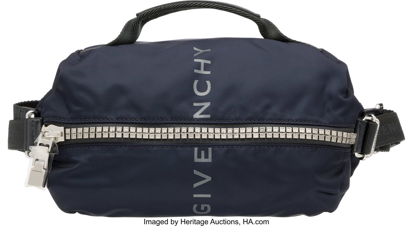 Givenchy Navy Blue & Black Nylon Waist Bag with : Givenchy Navy Blue & Black Nylon Waist Bag with Silver Hardware Condition: 1 10" Width x 3.5" Height x 5" Depth This bag is done in Navy Blue Nylon with Silver Hardware,