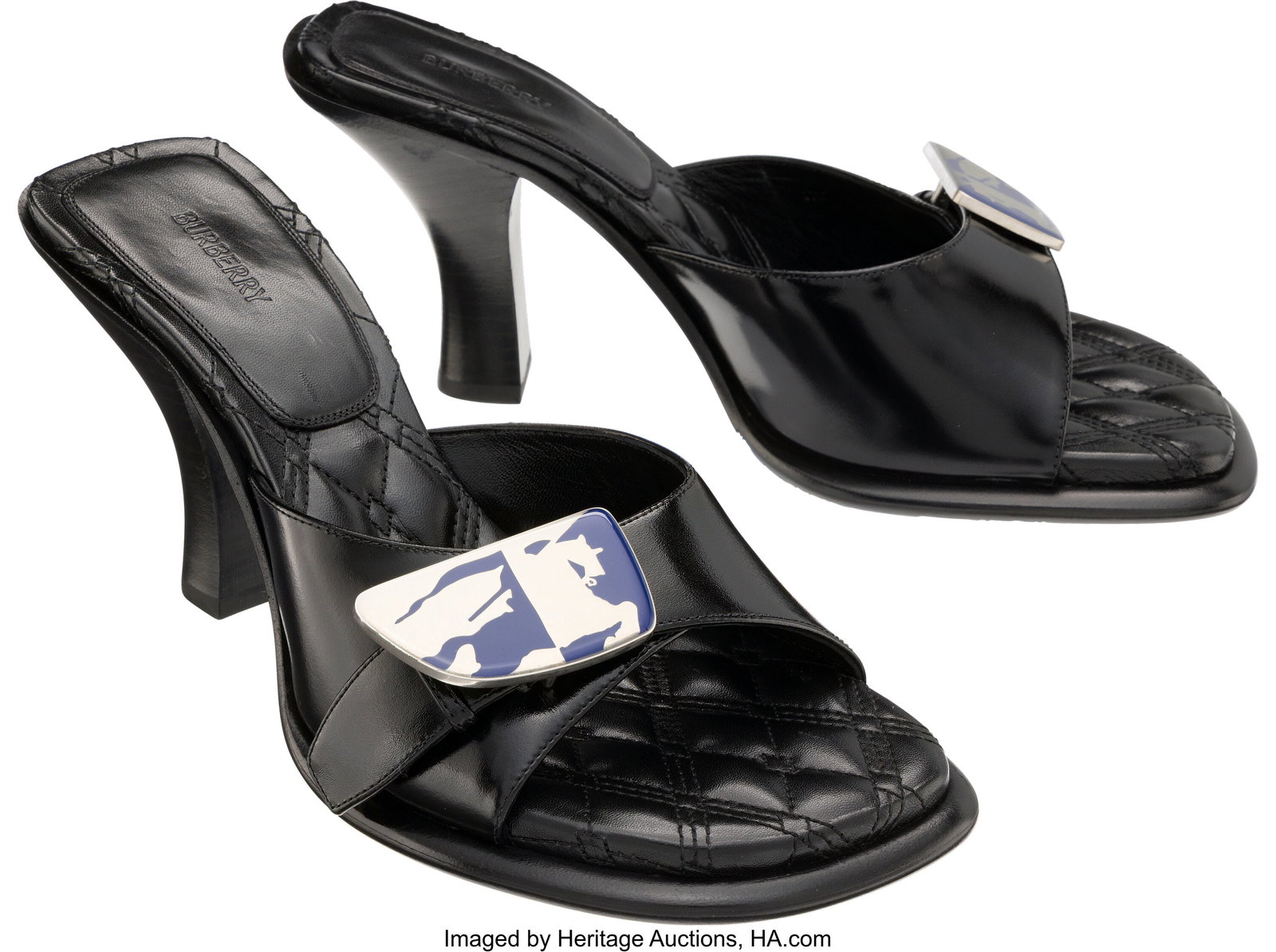 Burberry Black Leather Bay Equestrian Knight Mot: Burberry Black Leather Bay Equestrian Knight Motif Mules with Silver Hardware Condition: 1 Size: 39 These shoes are done in Black Leather, featuring a Blue and Silver buckle,