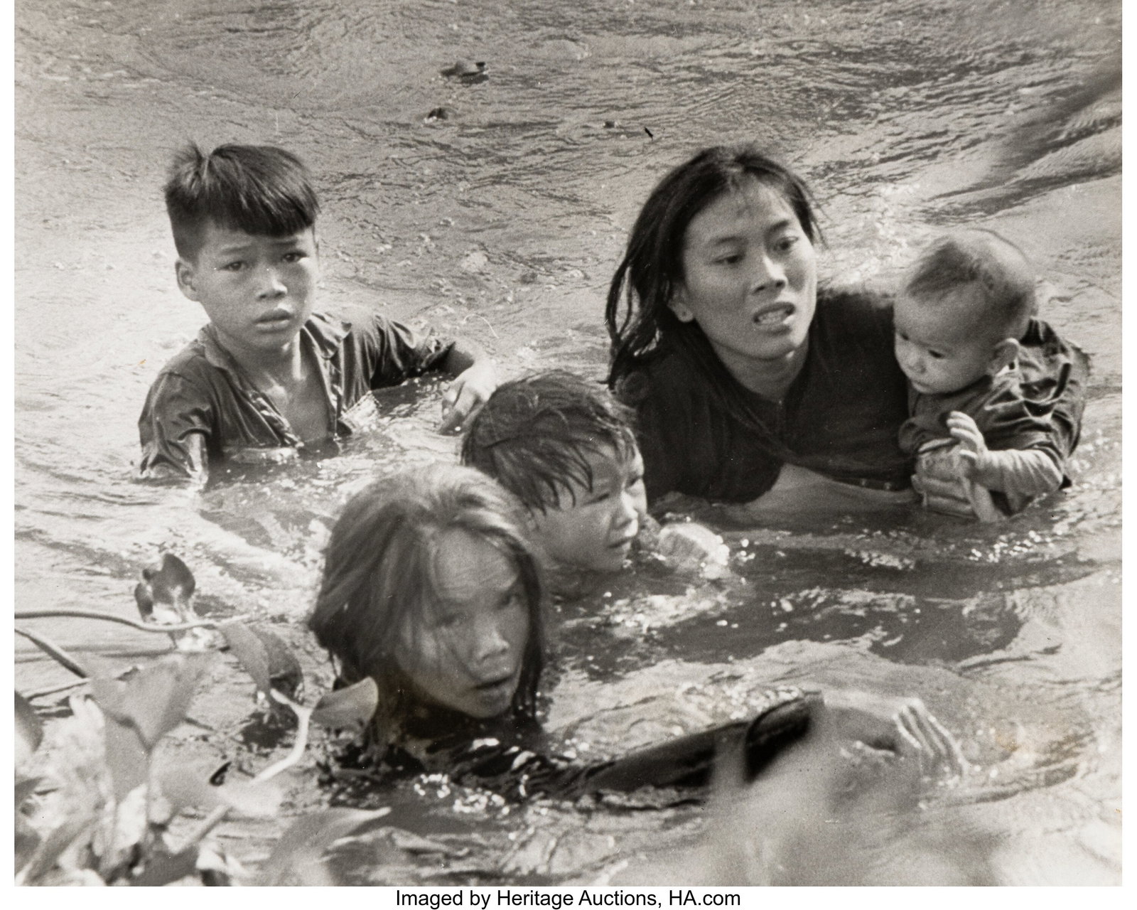 1966 Pulitzer Prize in Photography Winner Kyoich: 1966 Pulitzer Prize in Photography Winner Kyoichi Sawada (Japanese, 1936-1970) Mother and children wade across river to escape U.S. bombing. Qui Nhon, South 