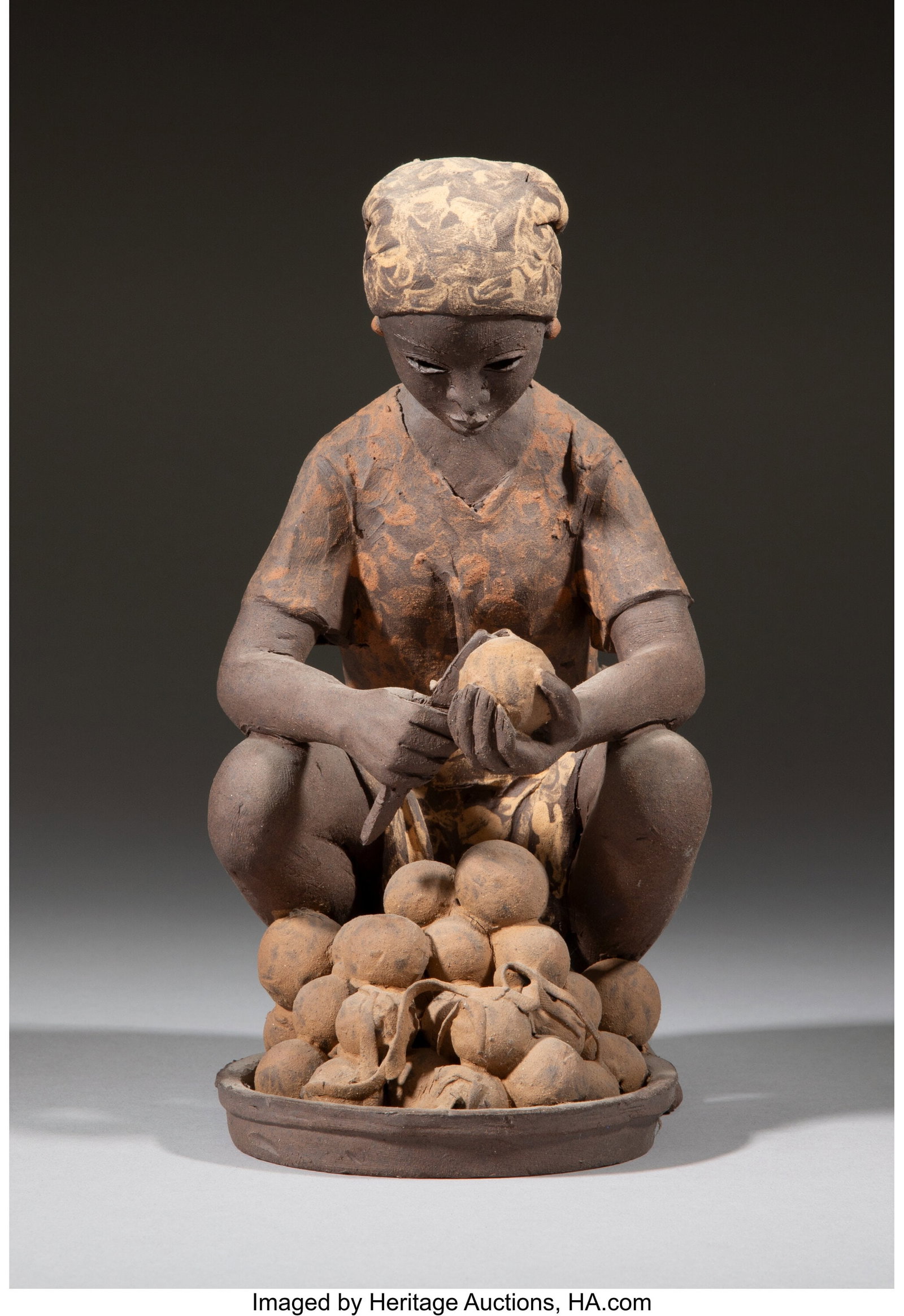 Reuben Ugbine (Nigerian, 1956-2021) Sculpture of: Reuben Ugbine (Nigerian, 1956-2021) Sculpture of Nigerian Woman, 2004 Fired clay 8-1/4 x 5-3/4 x 4-1/8 inches (21.0 x 14.6 x 10.5 cm) I