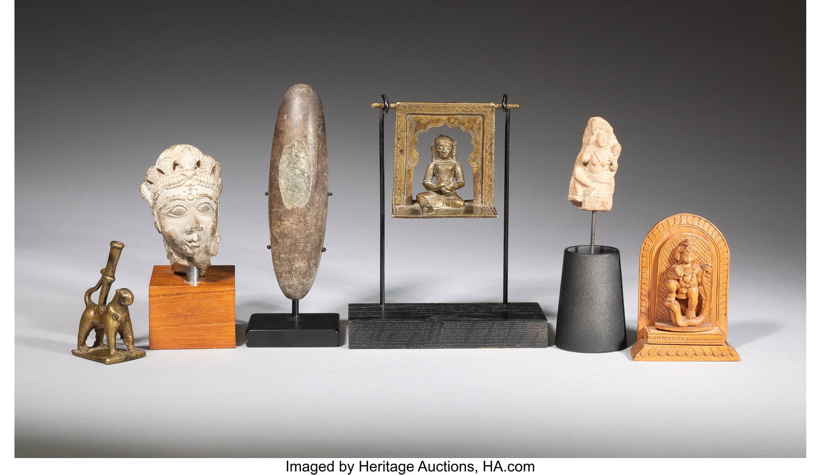 A Group of Six Asian Sandstone, Brass, Bronze, a (1 of 2)