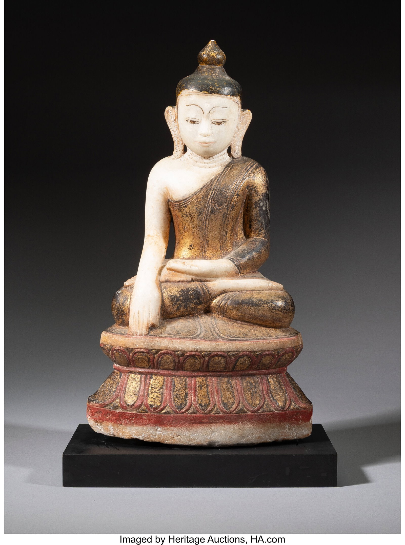 A Burmese Painted and Partial Gilt Alabaster Sha: A Burmese Painted and Partial Gilt Alabaster Shan-Style Seated Buddha 18-1/4 x 10 x 5 inches (46.4 x 25.4 x 12.7 cm) (work) 20 x 12 x 6-3/8 inches &lpa