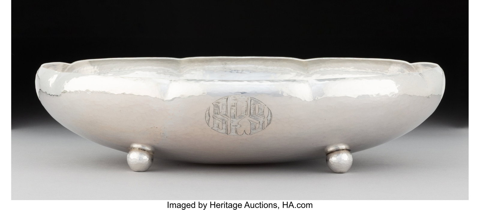 A Whiting Mfg. Co. Hand-Hammered Silver Oval Flu: A Whiting Mfg. Co. Hand-Hammered Silver Oval Fluted Footed Bowl, New York, 1913 Marks: (W-griffin), STERLING, 8105, (date mark)