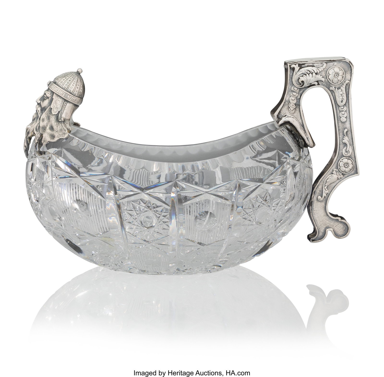 A Russian Silver-Mounted and Cut-Glass Kovsh Mak: A Russian Silver-Mounted and Cut-Glass Kovsh Maker's marks illegible, likely the 14th Artel, St. Petersburg, circa 1900 6-1/8 x 9-1/2 x 4-1/2 inches (15&perio