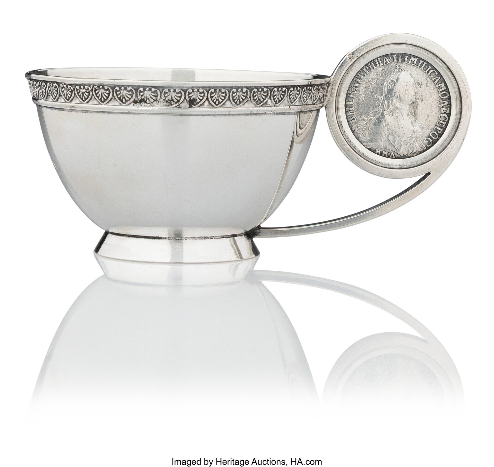 A Russian Silver Coin-Set Charka Workmaster's in: A Russian Silver Coin-Set Charka Workmaster's initials SP in Cyrillic, St. Petersburg, 1908-1917 1-7/8 x 3-3/4 x 2-5/8 inches (4.8 x 9.5 x 6.7 