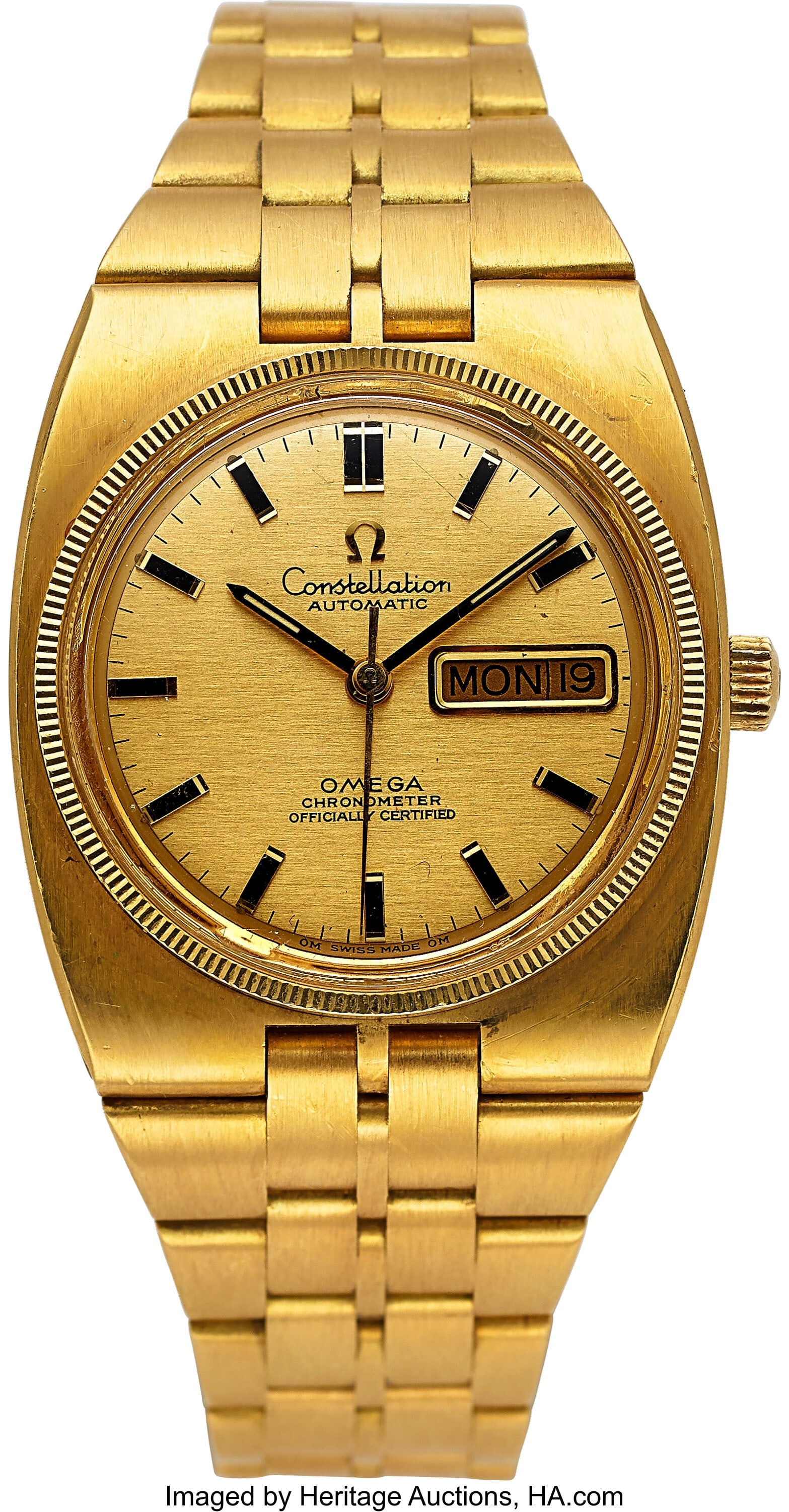 Omega Heavy 18k Gold Constellation Day/Date 168.: Omega Heavy 18k Gold Constellation Day/Date 168.045-368, circa 1970 Case: 36 mm, 18k gold case and band, two body, tonneau, screw down case back, r