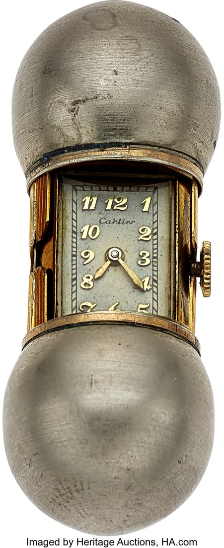 Cartier/Movado, Unusual "Time Capsule" Form Erme: Cartier/Movado, Unusual "Time Capsule" Form Ermeto, circa 1940's Case: 46 mm end to end, gold filled and steel, three body, steel end caps, spring loaded 