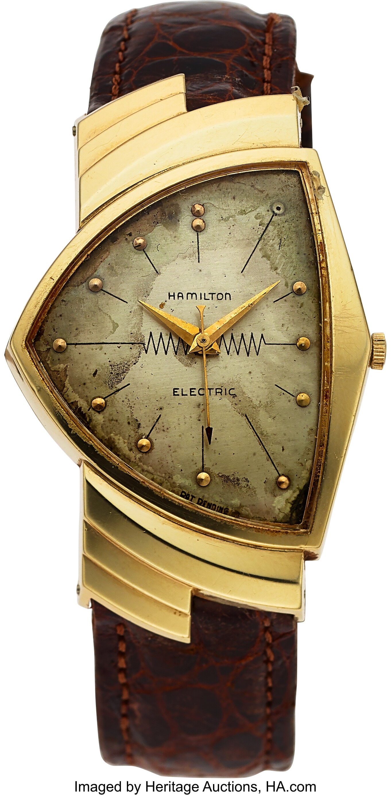 Hamilton, Rare 14k Gold Ventura Electric Wristwa: Hamilton, Rare 14k Gold Ventura Electric Wristwatch Case: 32 mm x 46 mm, 14k yellow gold, two body S case, asymmetrical Dial: silver, gold hour discs, g