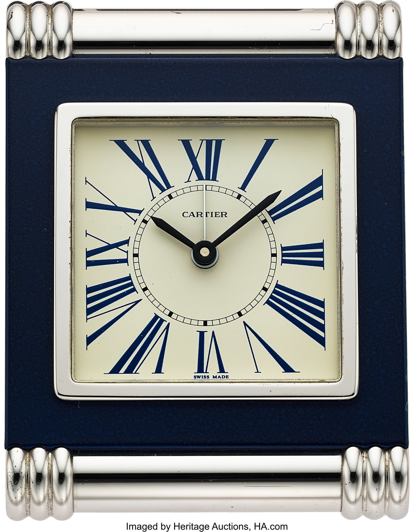 Cartier Lapis Lazuli Travel Clock Case: rectang: Cartier Lapis Lazuli Travel Clock Case: rectangular lapis lazuli-style blue case with polished gilt metal bezel and ribbed cylindrical accents at top and bottom Dial: white dial with blue 