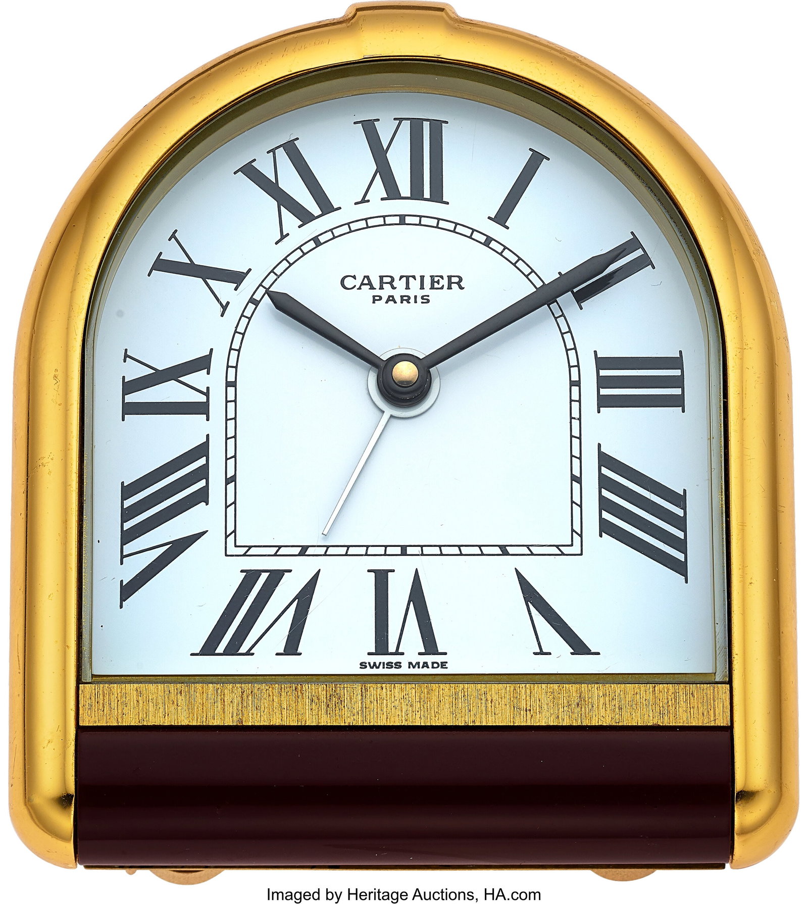 Cartier Tortue "Romaine" Alarm Desk Clock Case: Cartier Tortue "Romaine" Alarm Desk Clock Case: 75mm, gold plate with gilt brass, 05994 Dial: white roman dial , black baton hands Movement: Swiss quartz with alarm