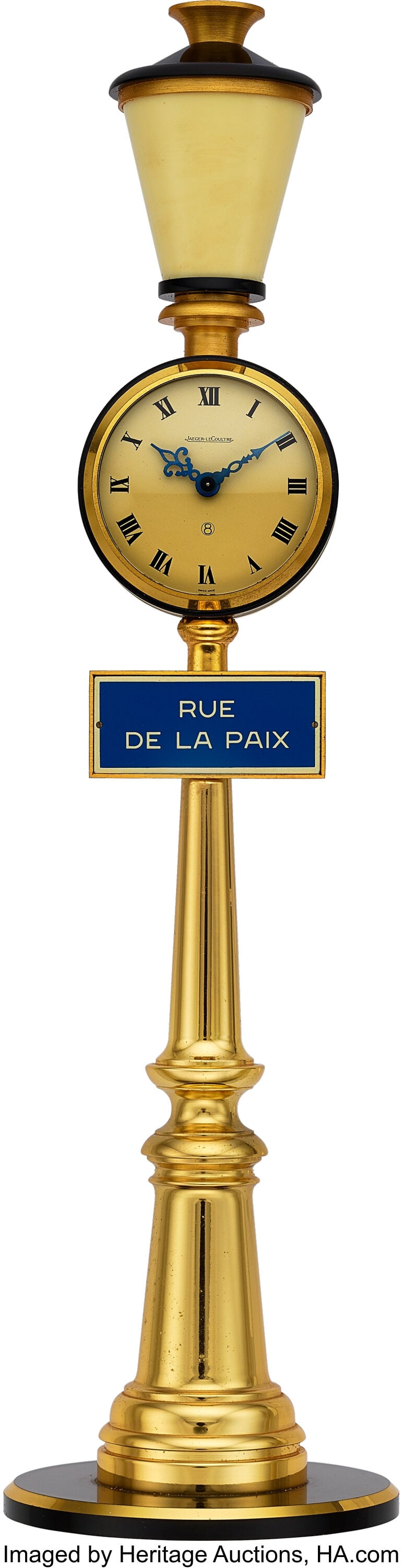 Jaeger LeCoultre Rue De La Paix 1960s Table Desk: Jaeger LeCoultre Rue De La Paix 1960s Table Desk Clock Case: 49mm, brass, metal, plastic Dial: off-white dial with black Roman numerals, blue steel hands Movement&c