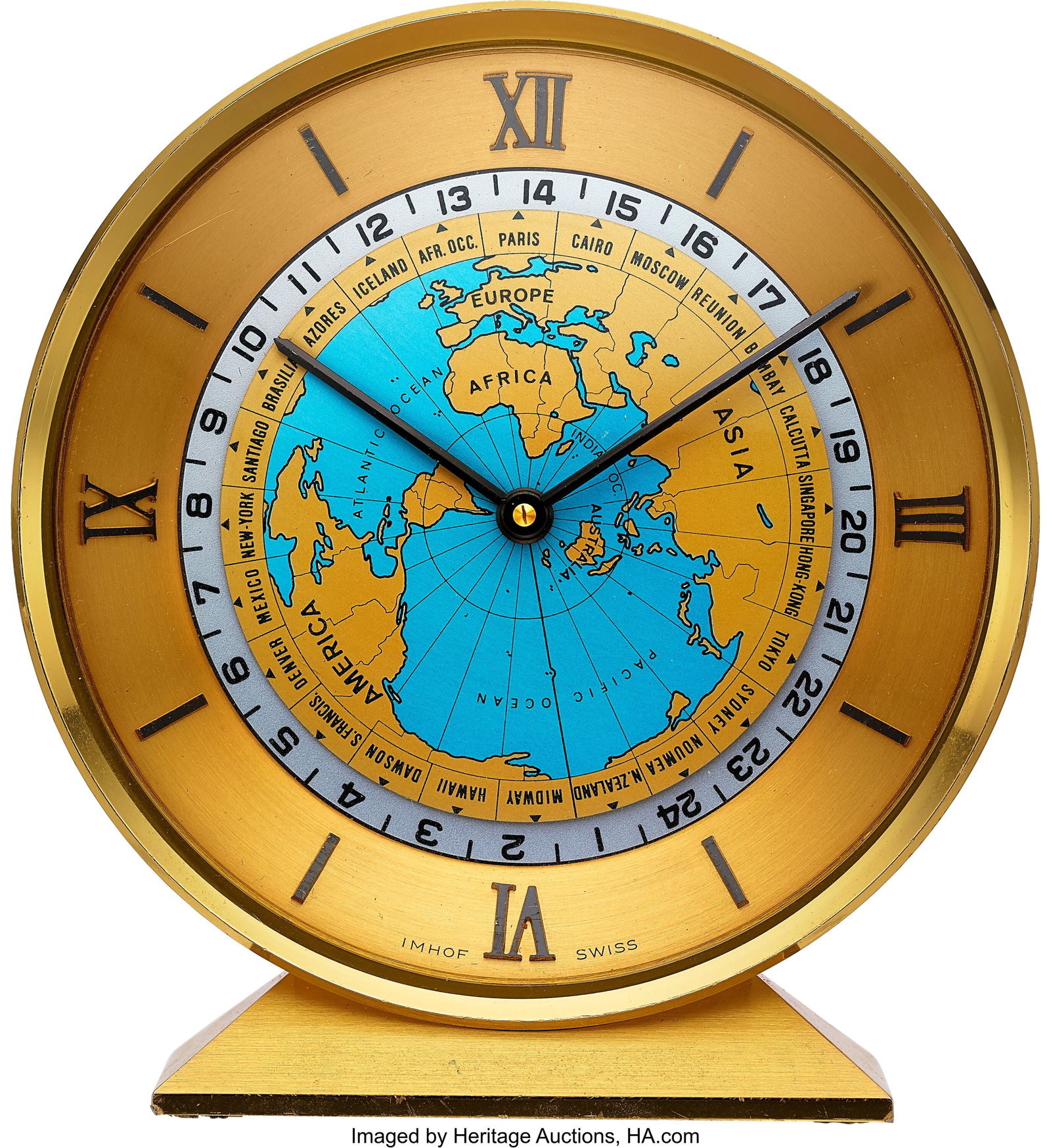 Imhof Style Clock Worldwide Table Clock Case: 4: Imhof Style Clock Worldwide Table Clock Case: 4 1/2 inches, polished brass, 1 673544 Dial: gold roman dial with a captivating blue and gold mappa mundi, offering a un