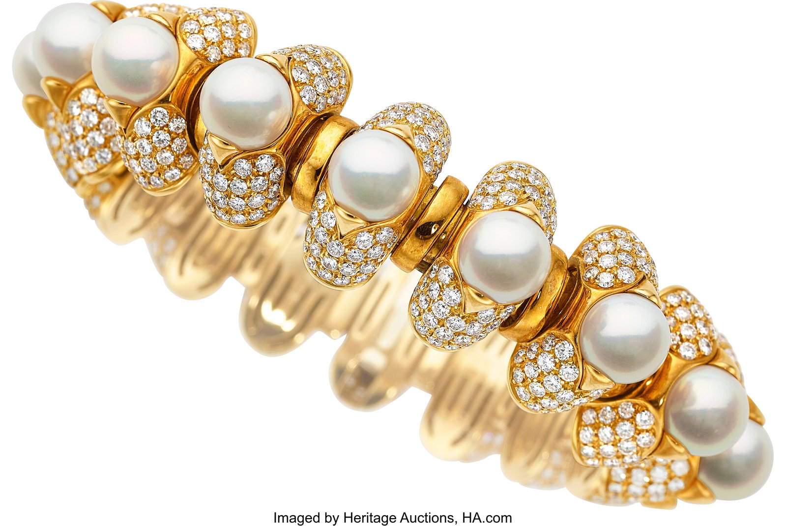 Bvlgari Diamond, Cultured Pearl, Gold Bracelet : Bvlgari Diamond, Cultured Pearl, Gold Bracelet Stones: Full-cut diamonds weighing a total of approximately 16.00 carats Pearls: Akoya cultured pearls measuring 8.