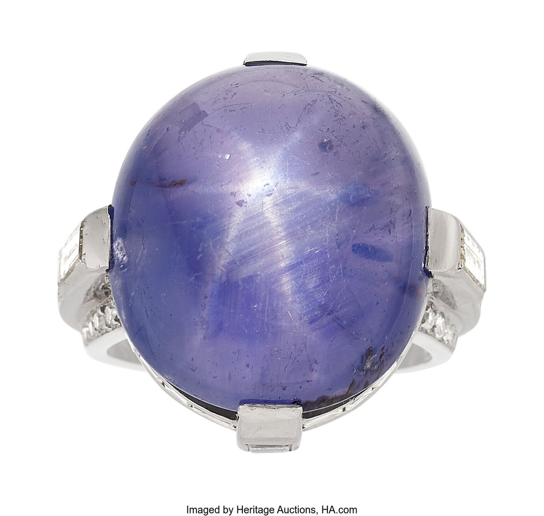 Cartier Purple Star Sapphire, Diamond, Platinum : Cartier Purple Star Sapphire, Diamond, Platinum Ring Stones: Purple star sapphire cabochon; carré-cut diamonds weighing a total of approximately 1.00 carat; b