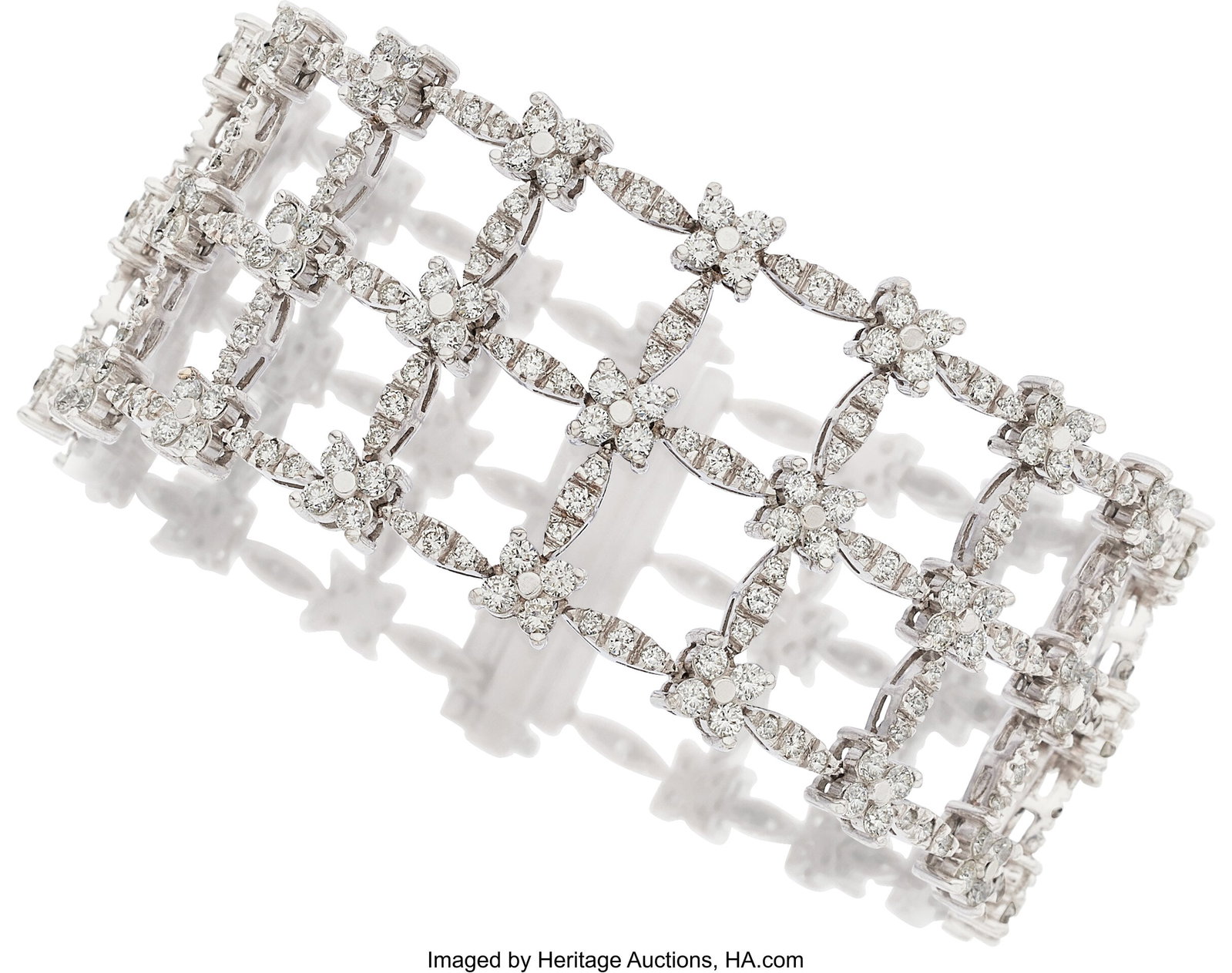 Diamond, White Gold Bracelet Stones: Full-cut d: Diamond, White Gold Bracelet Stones: Full-cut diamonds weighing a total of approximately 11.75 carats Metal: 18k white gold Gross Weight: 60.30 grams