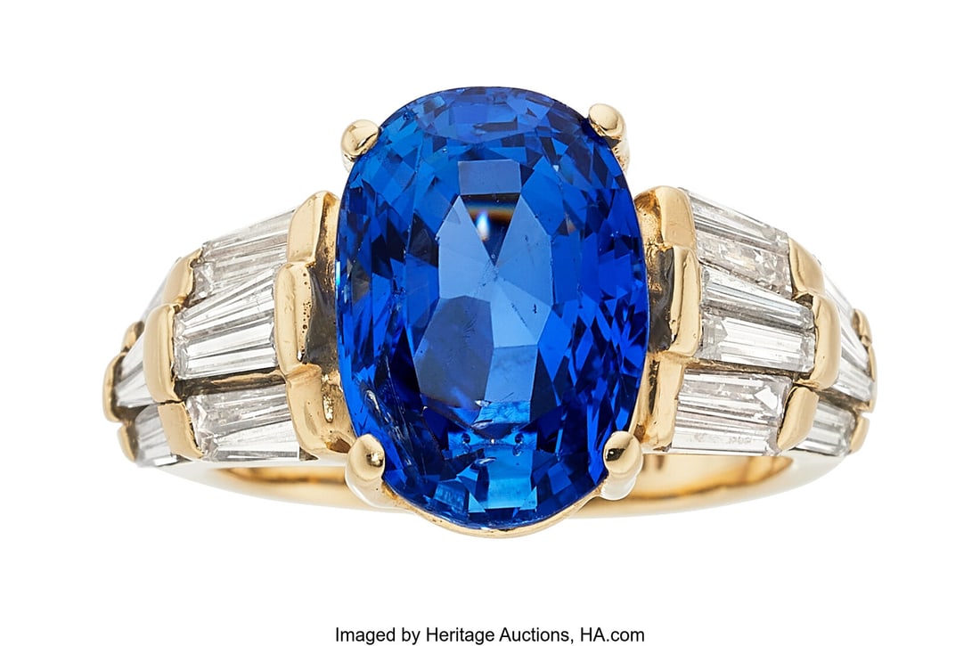 Ceylon Sapphire, Diamond, Gold Ring Stones: Ova: Ceylon Sapphire, Diamond, Gold Ring Stones: Oval-shaped sapphire weighing approximately 6.70 carats; tapered baguette-cut diamonds weighing a total of approximately 0&per