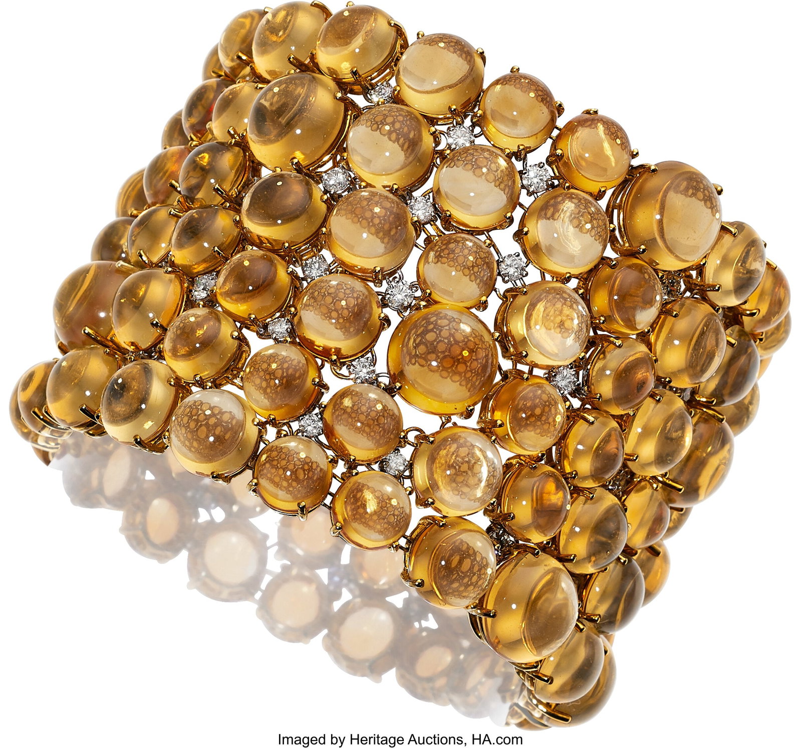 Assil Citrine, Diamond, Gold Bracelet Stones: C: Assil Citrine, Diamond, Gold Bracelet Stones: Citrine cabochons; full-cut diamonds weighing a total of approximately 4.45 carats Metal: 18k white and yellow gold
