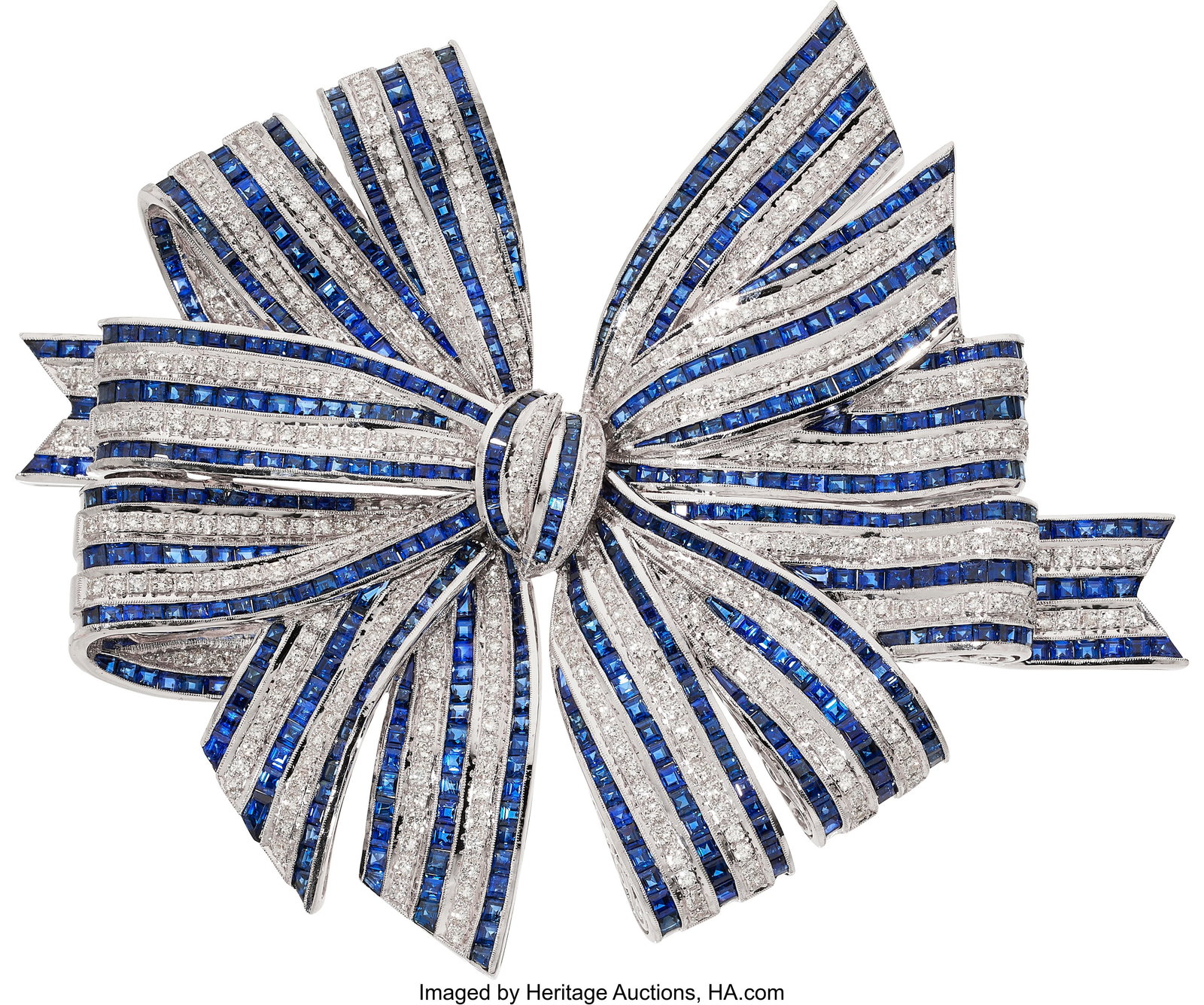 Sapphire, Diamond, White Gold Brooch Stones: Sq: Sapphire, Diamond, White Gold Brooch Stones: Square and calibré-cut sapphires weighing a total of approximately 13.50 carats; full-cut diamonds weighing a total of
