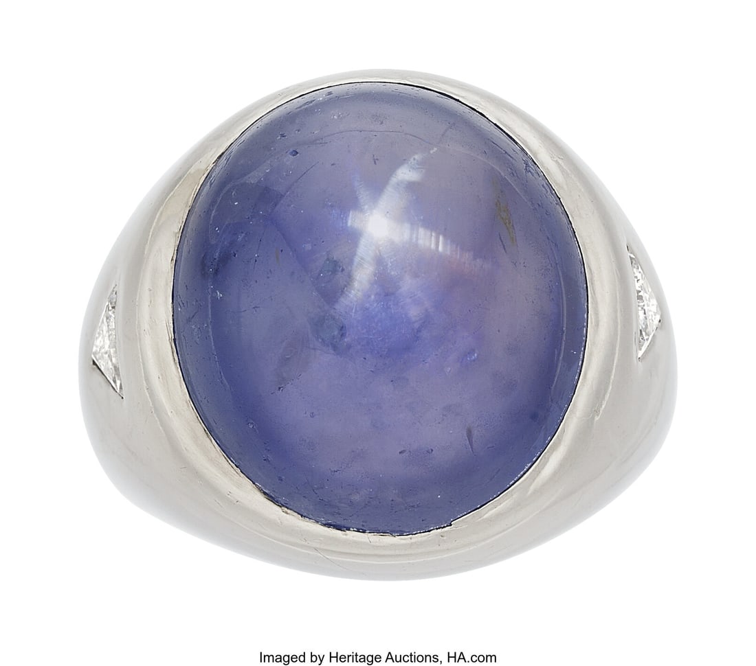 Ceylon Star Sapphire, Diamond, Platinum Ring St: Ceylon Star Sapphire, Diamond, Platinum Ring Stones: Star sapphire cabochon; triangular-shaped diamonds weighing a total of approximately 0.75 carat Metal: Platinum
