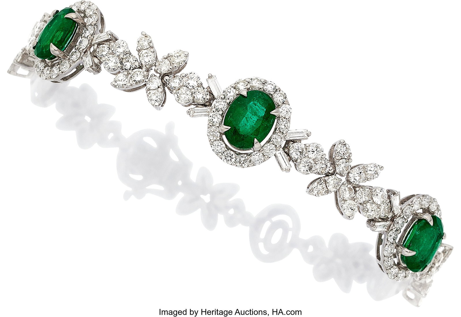Emerald, Diamond, White Gold Bracelet Stones: O: Emerald, Diamond, White Gold Bracelet Stones: Oval-shaped emeralds weighing a total of approximately 3.00 carats; full-cut diamonds weighing a total of approximately 3&pe