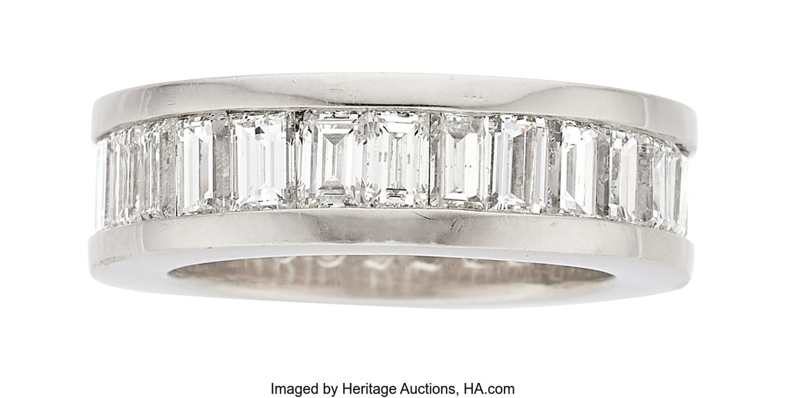 Diamond, Platinum Eternity Band Stones: Baguett: Diamond, Platinum Eternity Band Stones: Baguette-cut diamonds weighing a total of approximately 5.25 carats Metal: Platinum Gross Weight: 15.90 grams Size: 