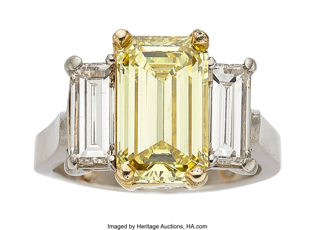 Fancy Yellow Diamond, Diamond, Platinum, Gold Ri: Fancy Yellow Diamond, Diamond, Platinum, Gold Ring Stones: Emerald-cut fancy yellow diamond weighing 4.44 carats; baguette-cut diamonds weighing a total of approxim