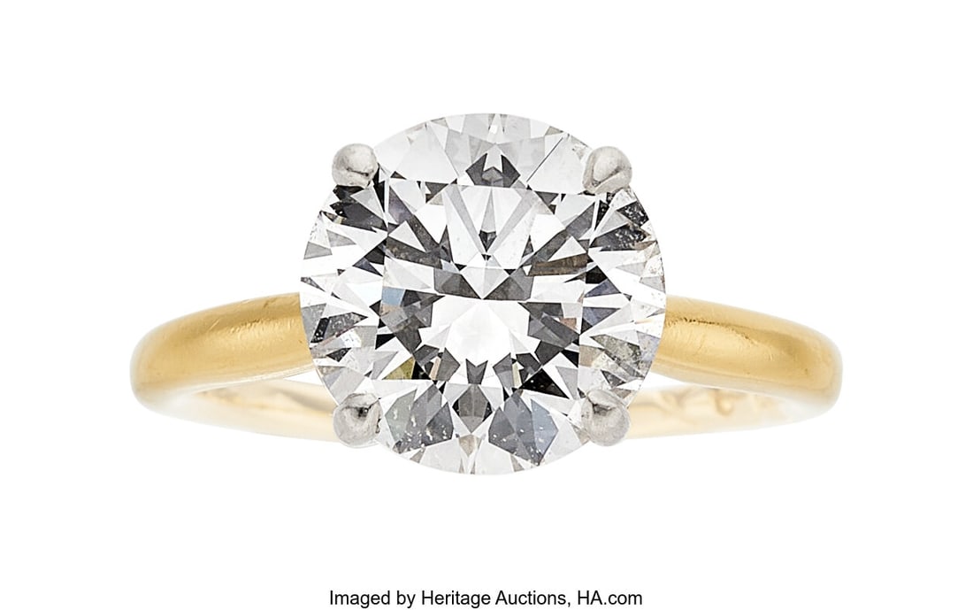 A. Jaffe Diamond, Platinum, Gold Ring Stones: R: A. Jaffe Diamond, Platinum, Gold Ring Stones: Round brilliant-cut diamond weighing 3.20 carats; full-cut diamonds Metal: Platinum and 18k gold Marked: 