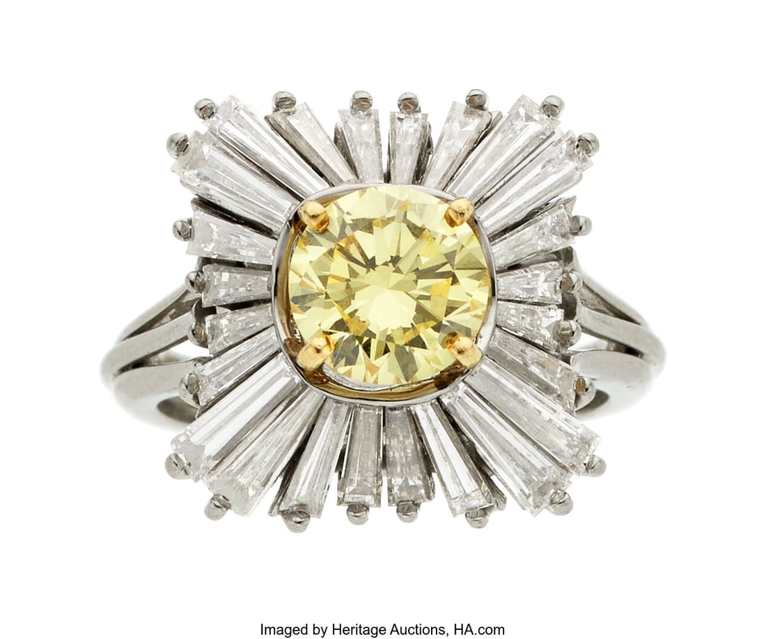 Fancy Intense Yellow Diamond, Diamond, Platinum: Fancy Intense Yellow Diamond, Diamond, Platinum, Gold Ring Stones: Round-shaped fancy intense yellow diamond weighing 1.27 carats; tapered baguette-cut diamonds wei