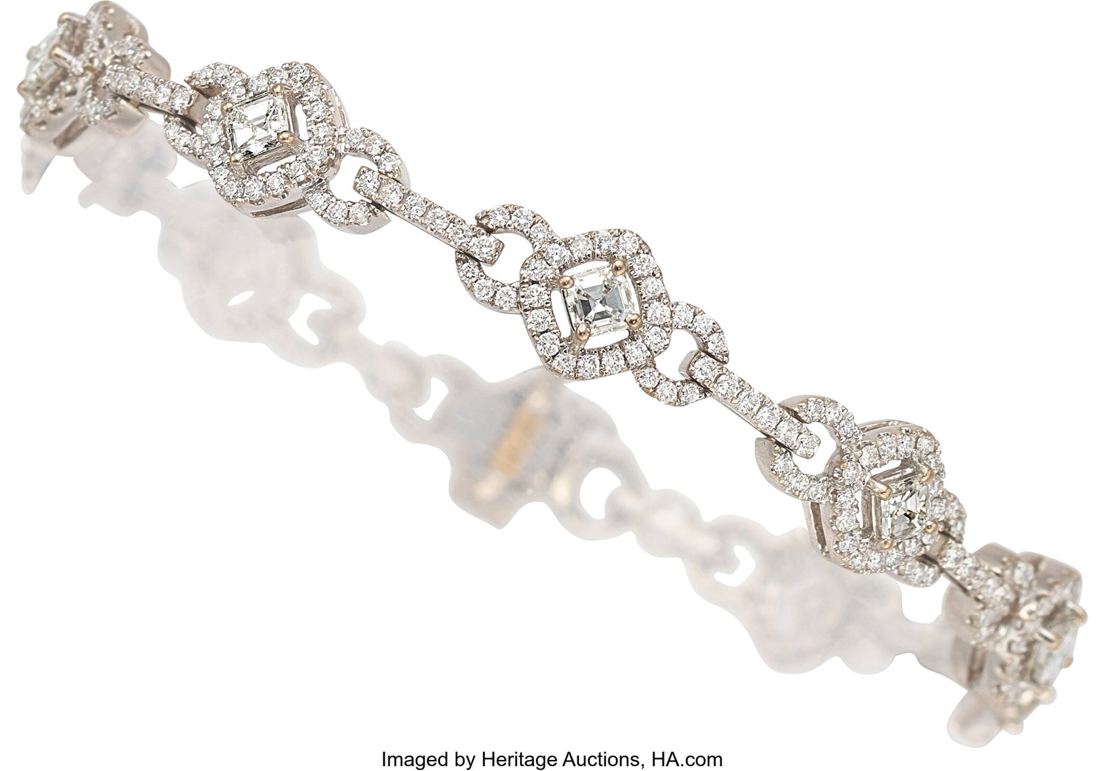 Diamond, White Gold Bracelet Stones: Square eme: Diamond, White Gold Bracelet Stones: Square emerald-cut diamonds weighing a total of approximately 1.45 carats; full-cut diamonds weighing a total of approximately 1.50 