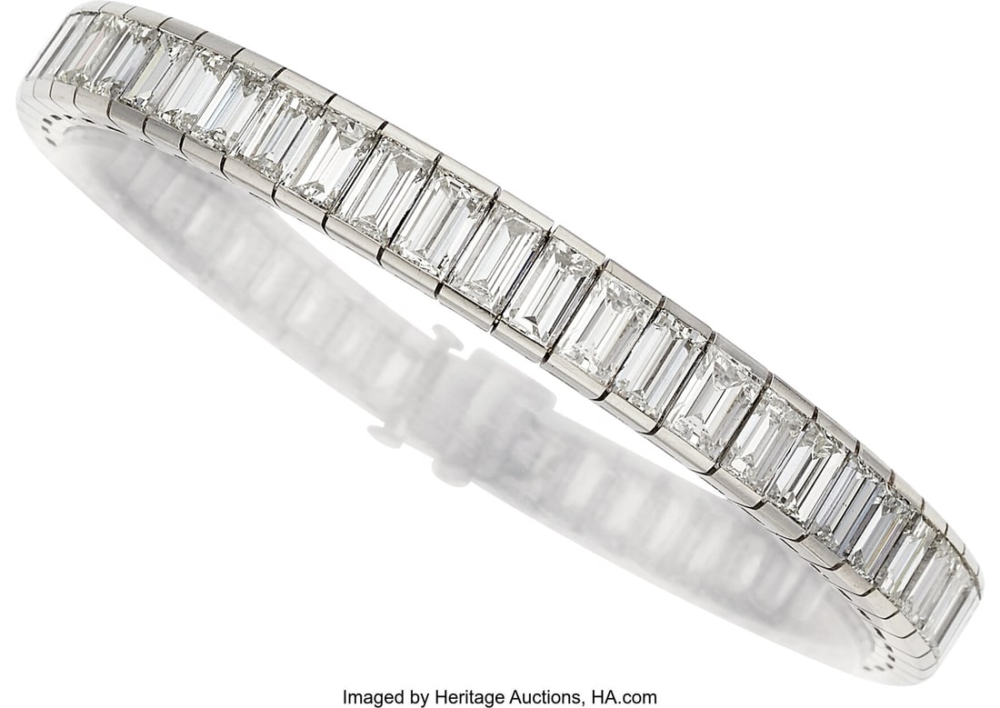 Diamond, Platinum Bracelet Stones: Baguette-cut: Diamond, Platinum Bracelet Stones: Baguette-cut diamonds weighing a total of approximately 17.00 carats Metal: Platinum Gross Weight: 33.10 grams Dimensions&colon