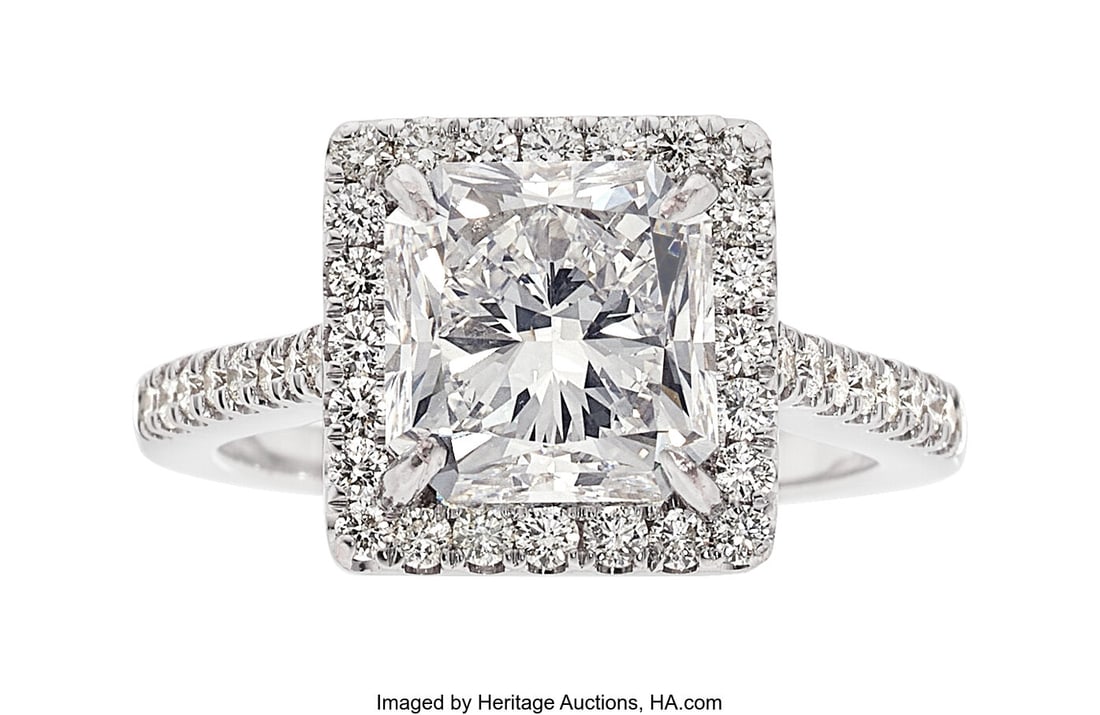 Diamond, White Gold Ring Stones: Cut-cornered s: Diamond, White Gold Ring Stones: Cut-cornered square-shaped diamond weighing 4.03 carats; full-cut diamonds weighing a total of approximately 0.60 carat Metal: 18k