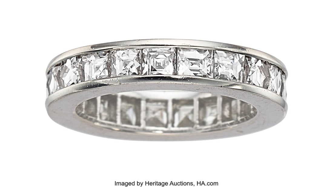 Diamond, Platinum Eternity Band Stones: French-: Diamond, Platinum Eternity Band Stones: French-cut diamonds weighing a total of 4.19 carats Metal: Platinum Gross Weight: 7.90 grams Size: 6 (not sizea