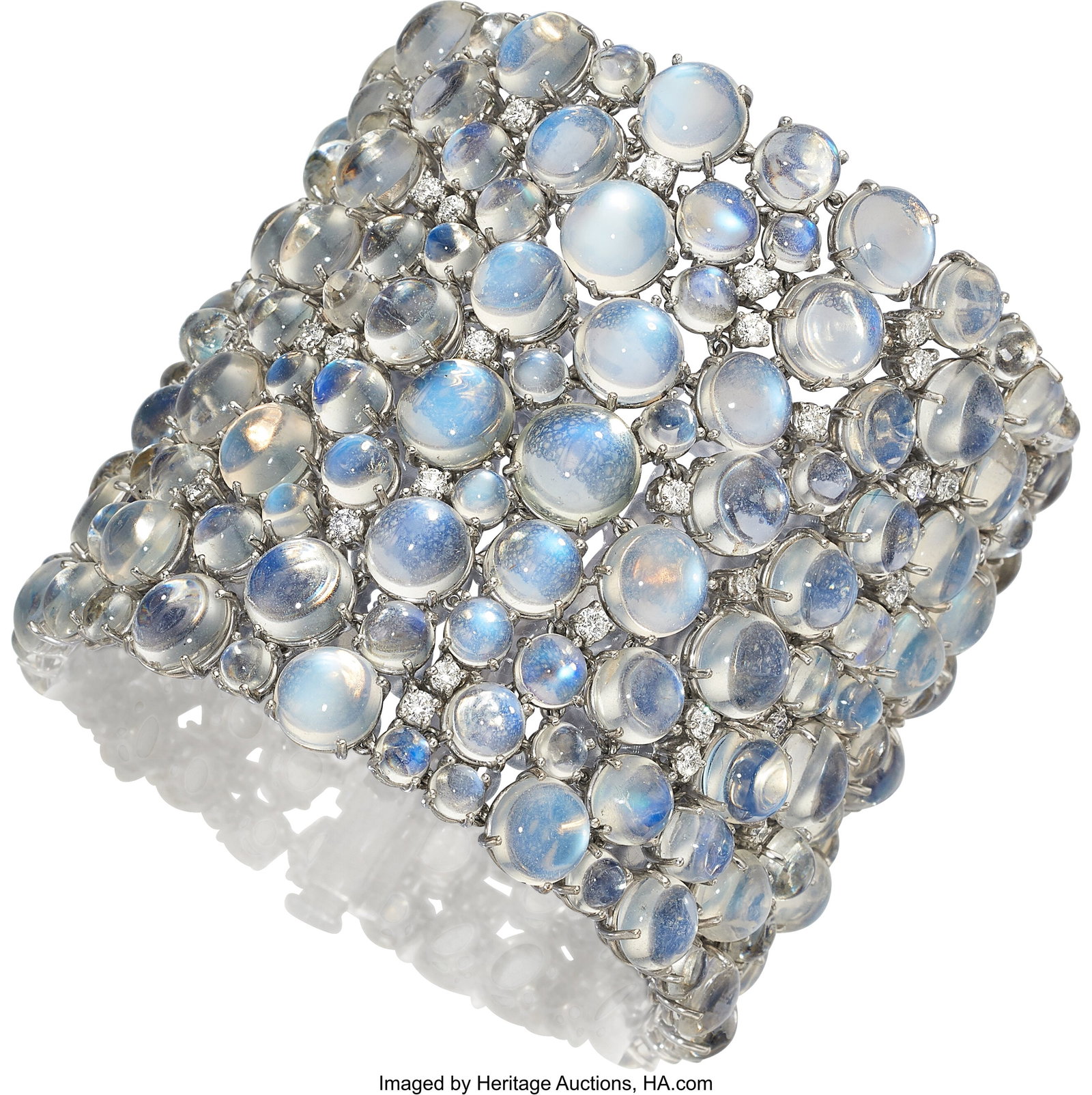 Moonstone, Diamond, White Gold Bracelet Stones: Moonstone, Diamond, White Gold Bracelet Stones: Full-cut diamonds weighing a total of approximately 4.40 carats; moonstone cabochons Metal: 18k white gold Gross Wei