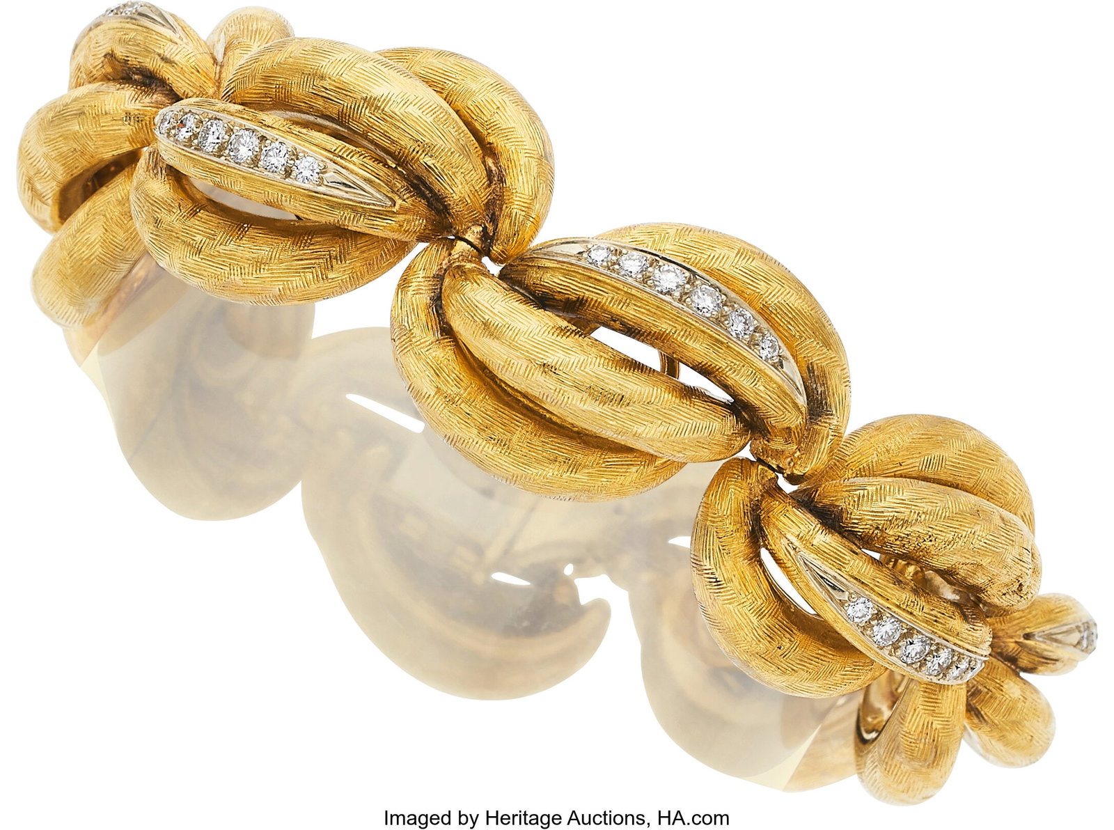 Diamond, Gold Bracelet Stones: Full-cut diamond: Diamond, Gold Bracelet Stones: Full-cut diamonds weighing a total of approximately 1.50 carats Metal: 18k gold Gross Weight: 119.20 grams Dimensions: