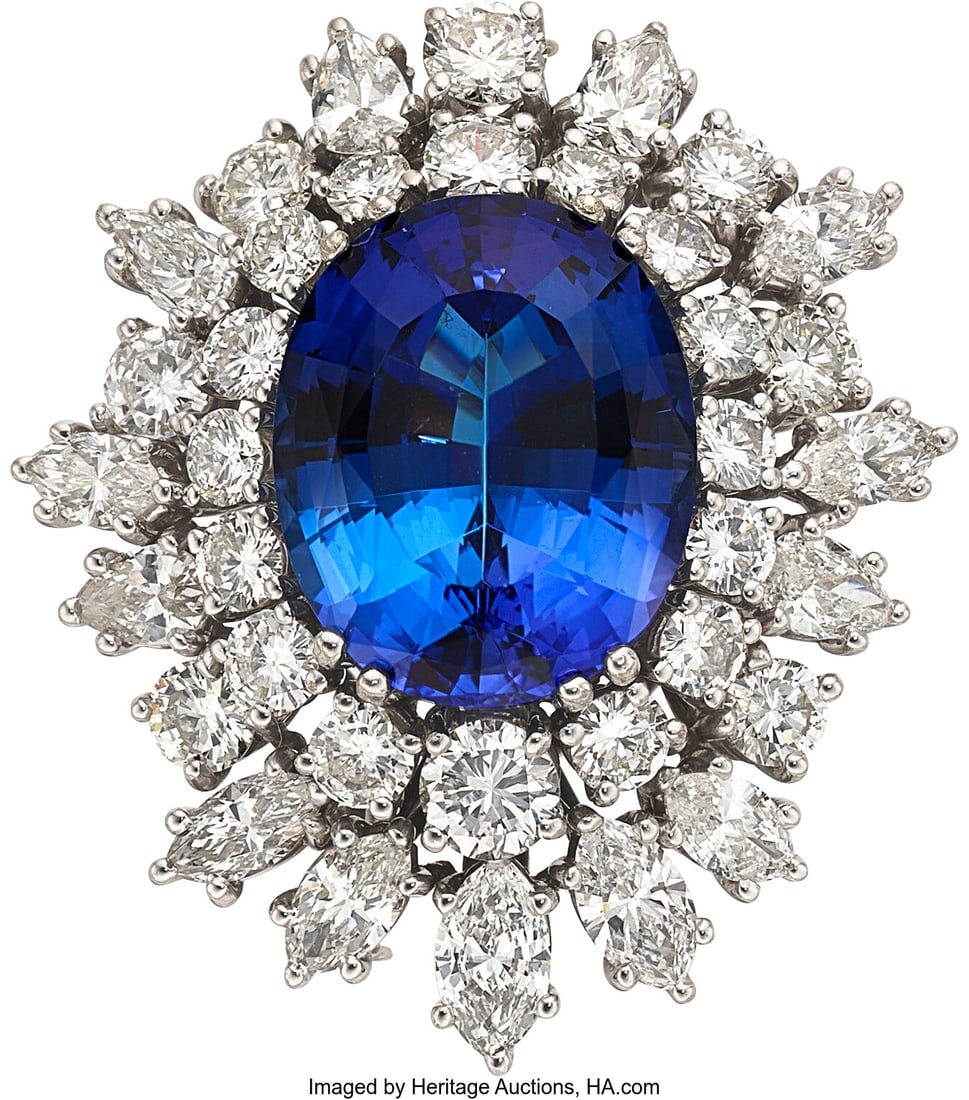 Tanzanite, Diamond, White Gold Pendant-Brooch : Tanzanite, Diamond, White Gold Pendant-Brooch Stones: Oval-shaped tanzanite weighing approximately 10.35 carats; full-cut diamonds weighing a total of approximately 3&per