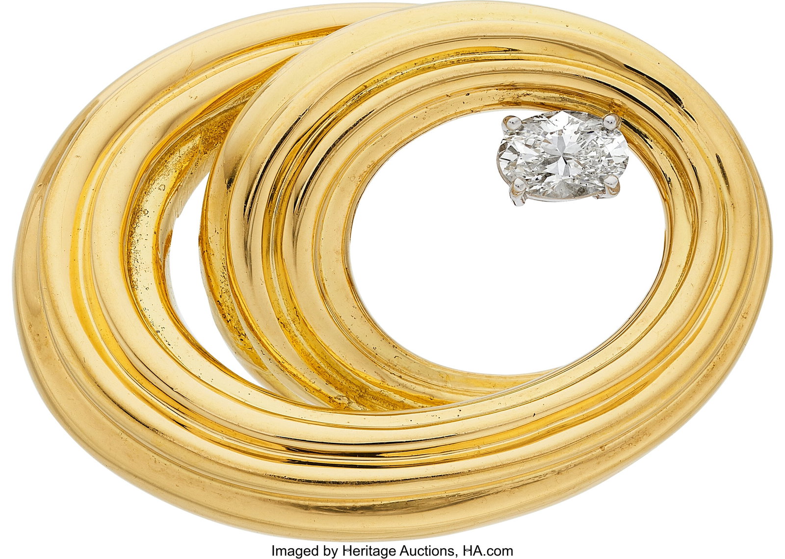 Diamond, Gold Brooch Stones: Oval-shaped diamon: Diamond, Gold Brooch Stones: Oval-shaped diamond weighing approximately 0.70 carat Metal: 18k gold Gross Weight: 19.10 grams Dimensions: 1-1/8 inches x 