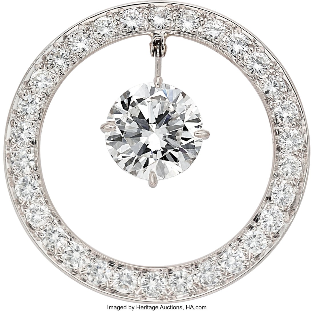 Diamond, Platinum Brooch Stones: Round brillian: Diamond, Platinum Brooch Stones: Round brilliant-cut diamond weighing 2.92 carats; full-cut diamonds weighing a total of approximately 1.15 carats Metal: Platinum 