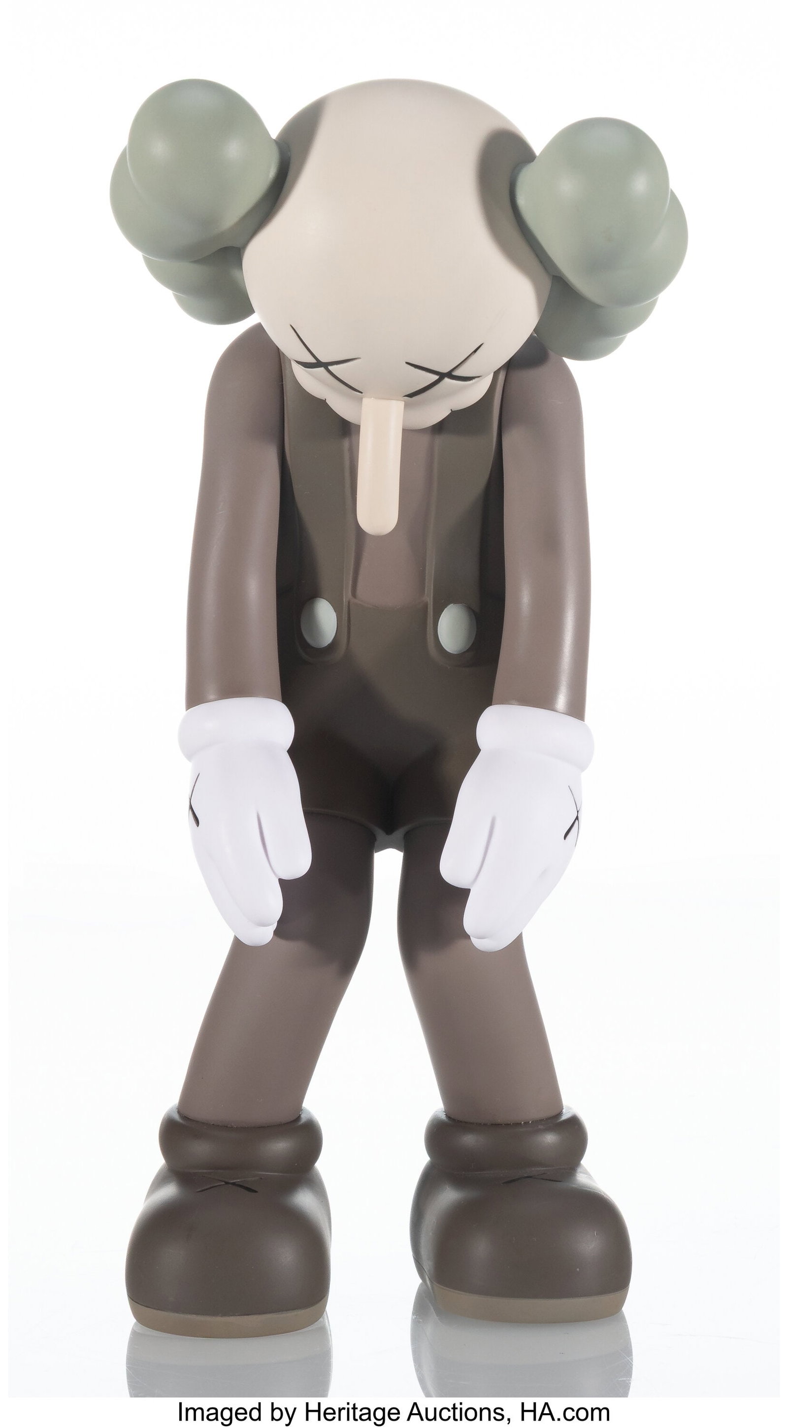 KAWS (b. 1974) Small Lie (Brown), 2017 Painted c: KAWS (b. 1974) Small Lie (Brown), 2017 Painted cast vinyl 11 x 5 x 4-1/2 inches (27.9 x 12.7 x 11.4 cm) Stamped on underside of feet