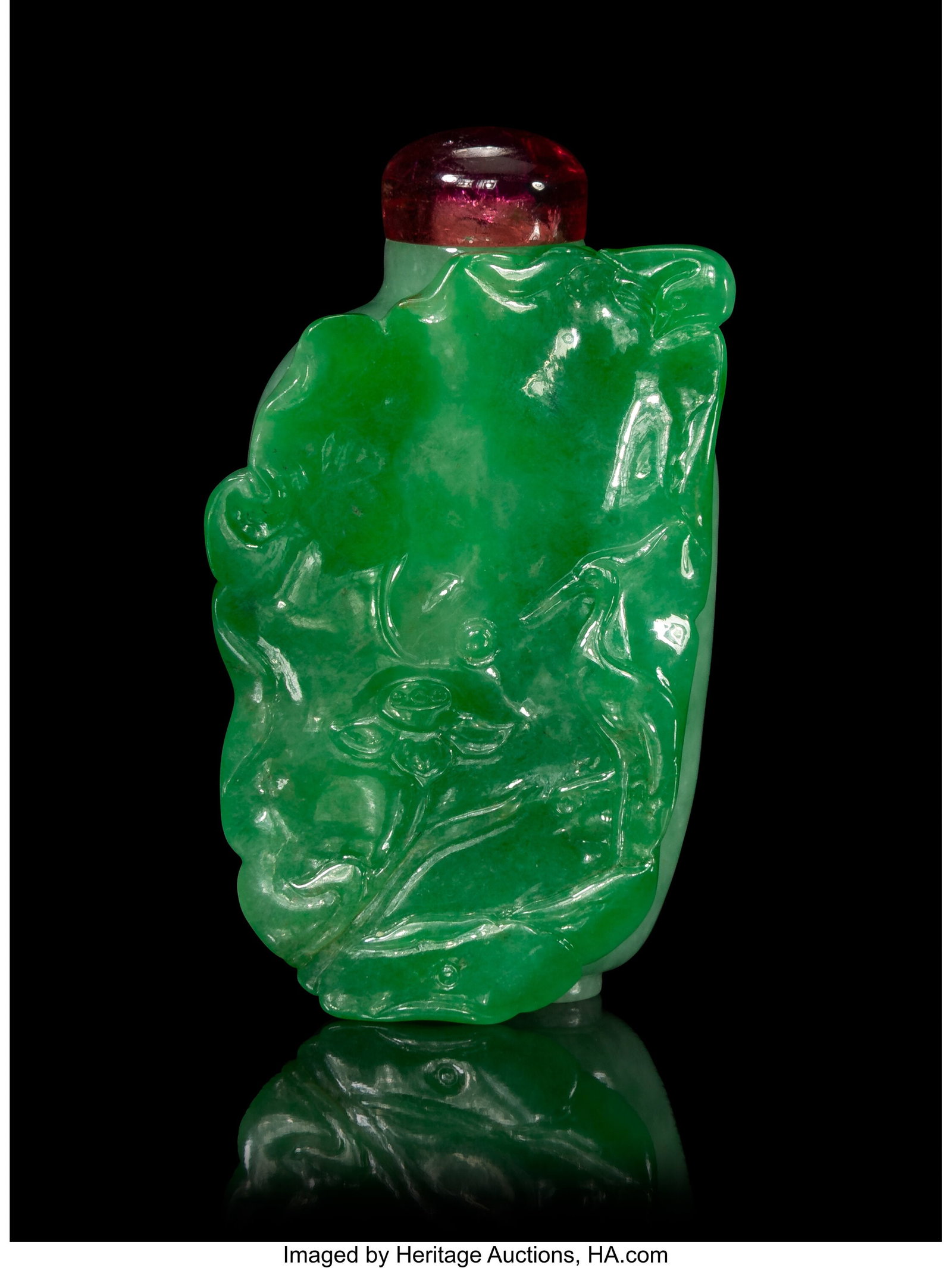 A Chinese Carved Apple Green Jadeite Snuff Bottl: A Chinese Carved Apple Green Jadeite Snuff Bottle, 19th/20th century 2-5/8 x 1-1/2 x 0-7/8 inches (6.7 x 3.8 x 2.2 cm) with tourmaline stopper Prop