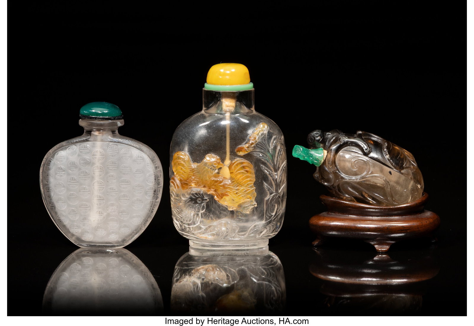 A Group of Three Chinese Rock Crystal Snuff Bott: A Group of Three Chinese Rock Crystal Snuff Bottles, 19th century 3-1/2 x 2-1/8 x 1-3/8 inches (8.9 x 5.4 x 3.5 cm) (tallest) The lot compris