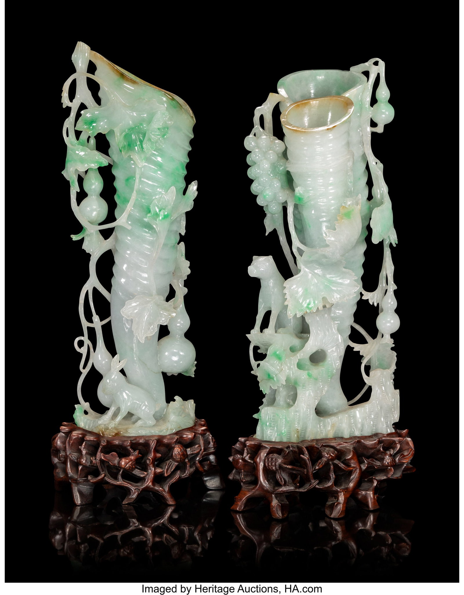A Pair of Chinese Carved Jadeite Rhyton-Form Vas: A Pair of Chinese Carved Jadeite Rhyton-Form Vases, 20th century 12-7/8 x 4-1/2 x 3 inches (32.7 x 11.4 x 7.6 cm) (tallest) PROVENANCE: Chr