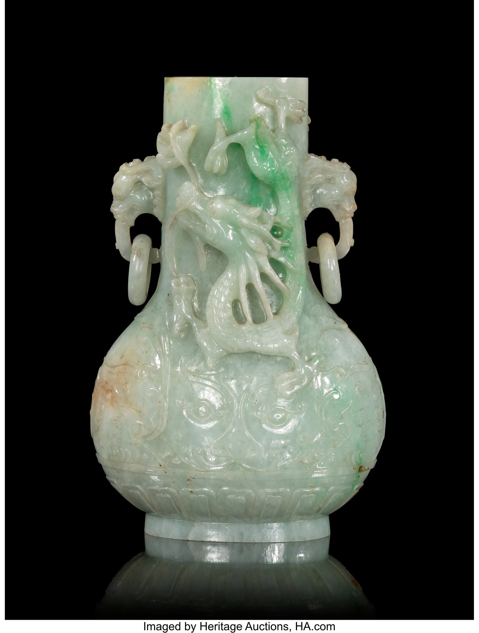 A Chinese Carved Jadeite 'Dragon' Double-Handled: A Chinese Carved Jadeite 'Dragon' Double-Handled Vase, 20th century 6-3/4 x 4 x 2-1/2 inches (17.1 x 10.2 x 6.3 cm) the stick neck vase of compressed globu
