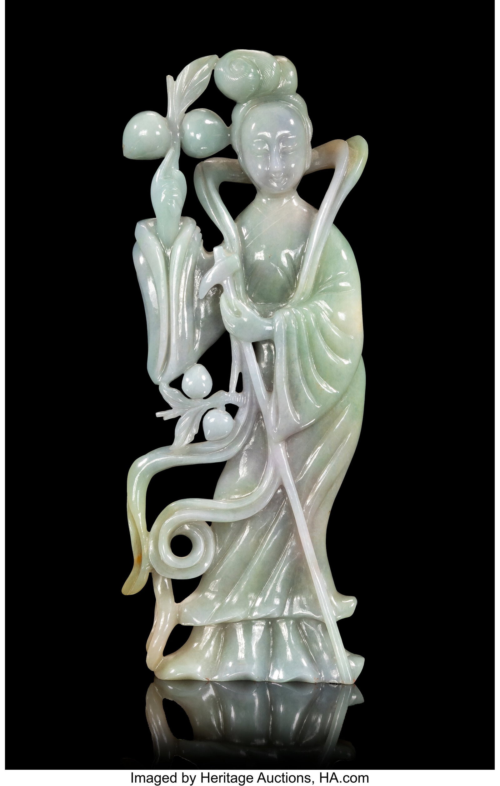 A Multi-Colored Chinese Jadeite Carving of a Mei: A Multi-Colored Chinese Jadeite Carving of a Meiren, 20th century 9-7/8 x 3-7/8 x 1-1/8 inches (25.1 x 9.8 x 2.9 cm) carved as a standing beauty holdin