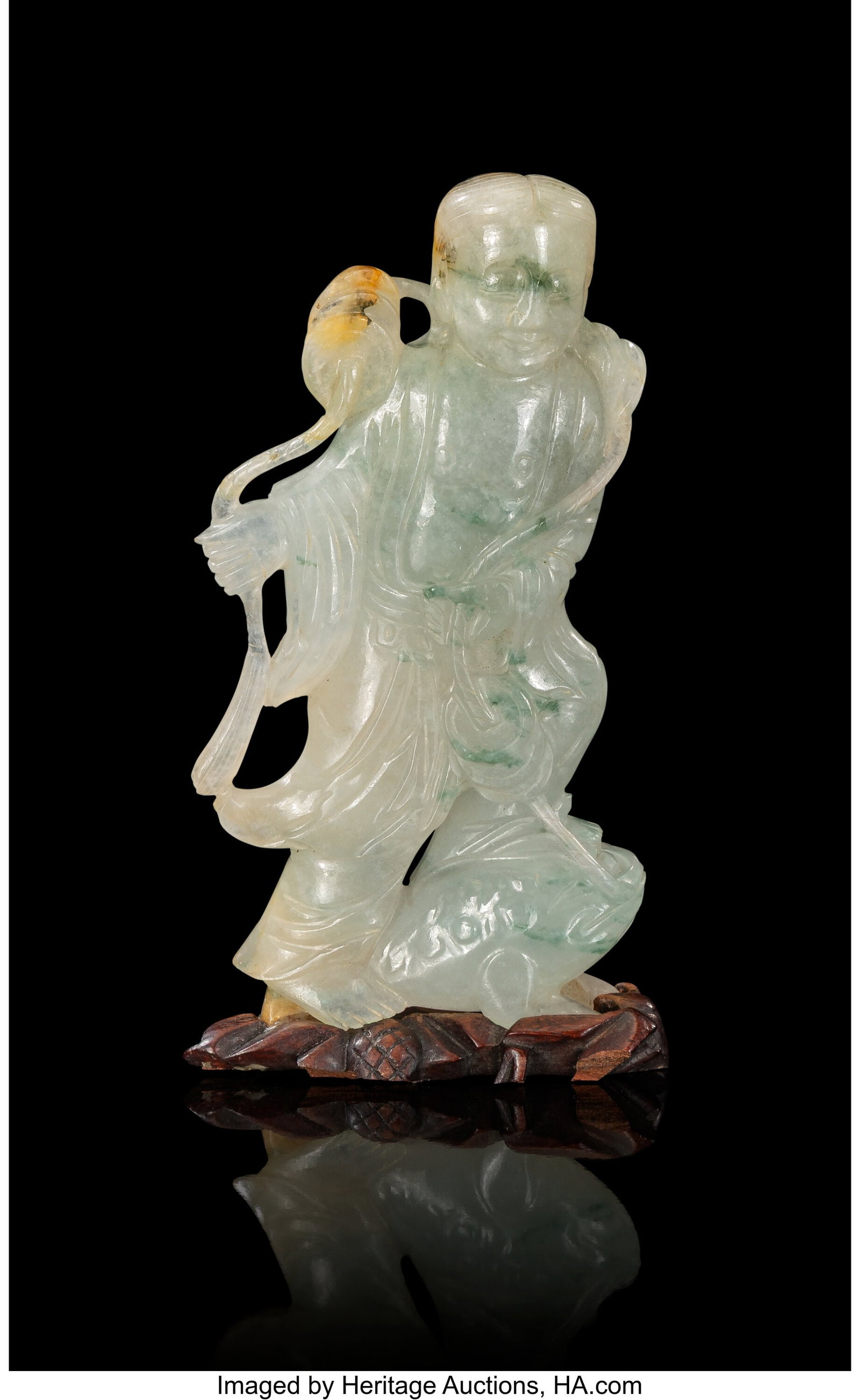 A Chinese Carved Jadeite Figure of Liu Hai and T: A Chinese Carved Jadeite Figure of Liu Hai and Toad, Qing dynasty 5 x 2-3/4 x 1-1/4 inches (12.7 x 7.0 x 3.2 cm) (overall) carved as the God of W
