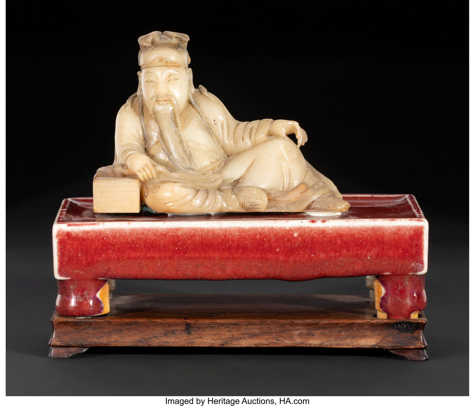 A Chinese Carved Soapstone Figure of a Reclining: A Chinese Carved Soapstone Figure of a Reclining Scholar, Late 17th/early 18th century 5 x 5-3/4 x 3-1/8 inches (12.7 x 14.6 x 7.9 cm) finely carved as