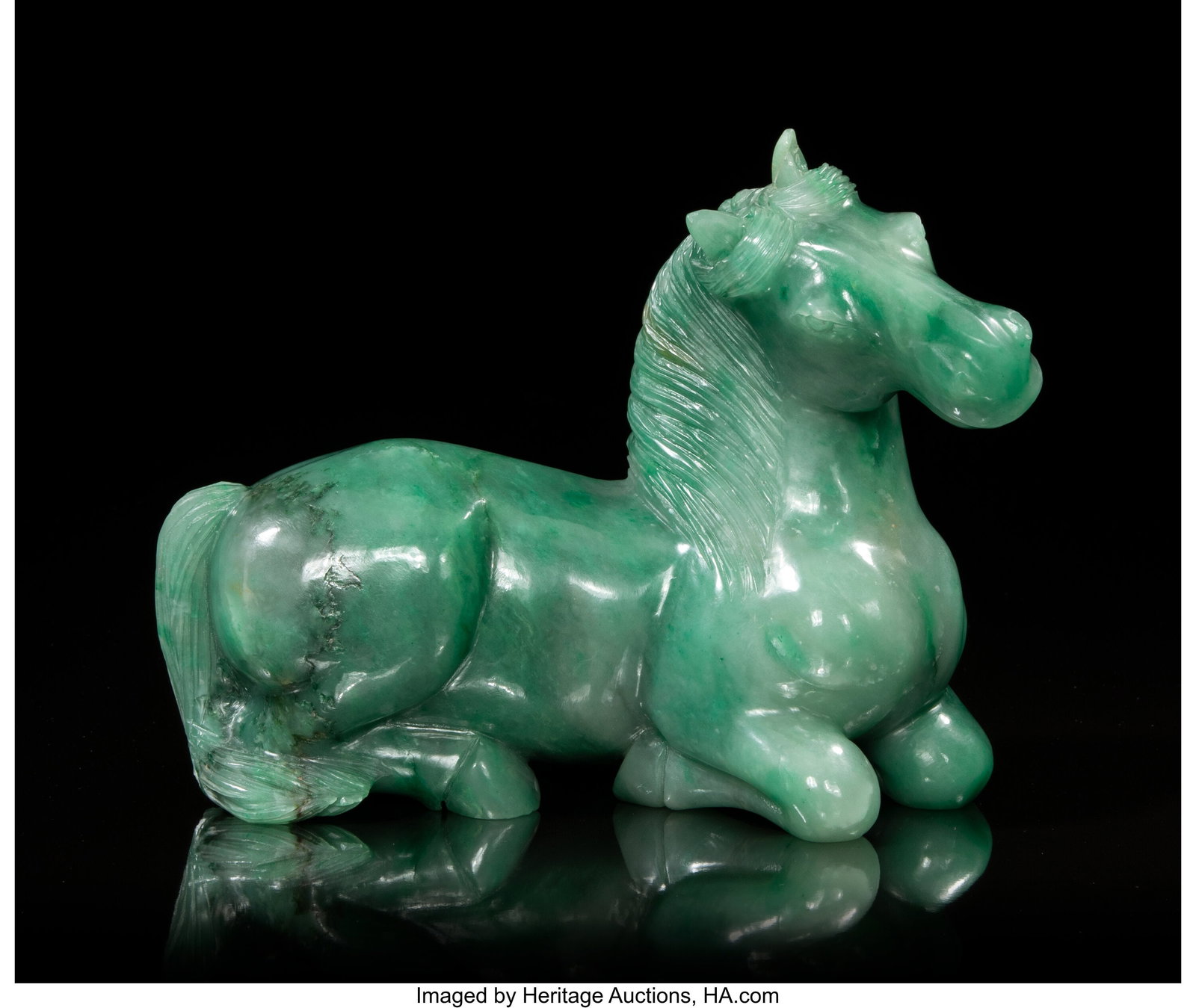 A Chinese Carved Green Jadeite Horse, 20th centu: A Chinese Carved Green Jadeite Horse, 20th century 6-1/2 x 8-3/4 x 4 inches (16.5 x 22.2 x 10.2 cm) Property from the Collection of Jack and Jane Chin HID0