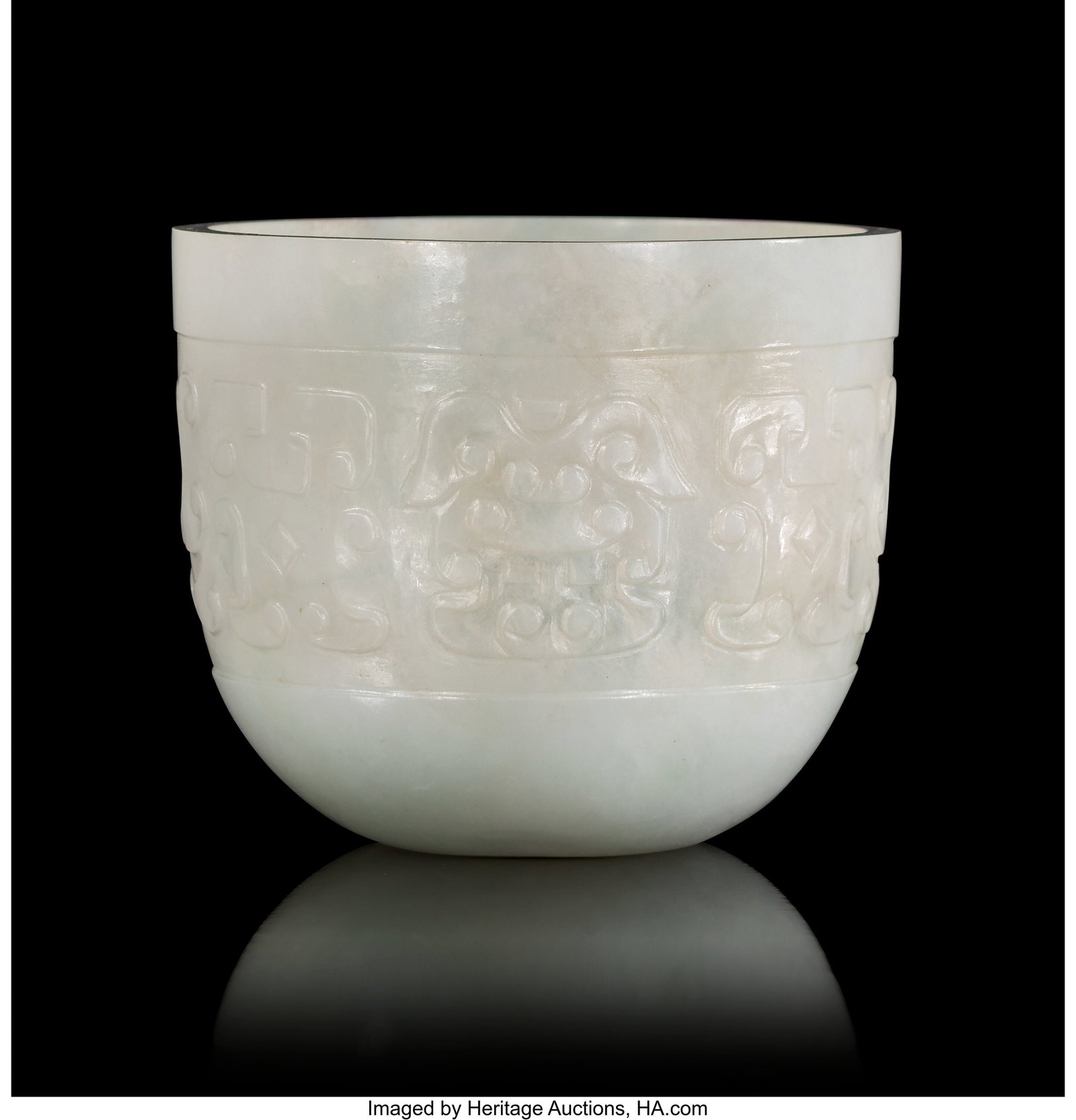 A Chinese Carved Jade Wine Cup, 19th century 1-3: A Chinese Carved Jade Wine Cup, 19th century 1-3/4 x 2-1/8 inches (4.4 x 5.4 cm) PROVENANCE: Sotheby's, Sale 5614, October 10, 1987,
