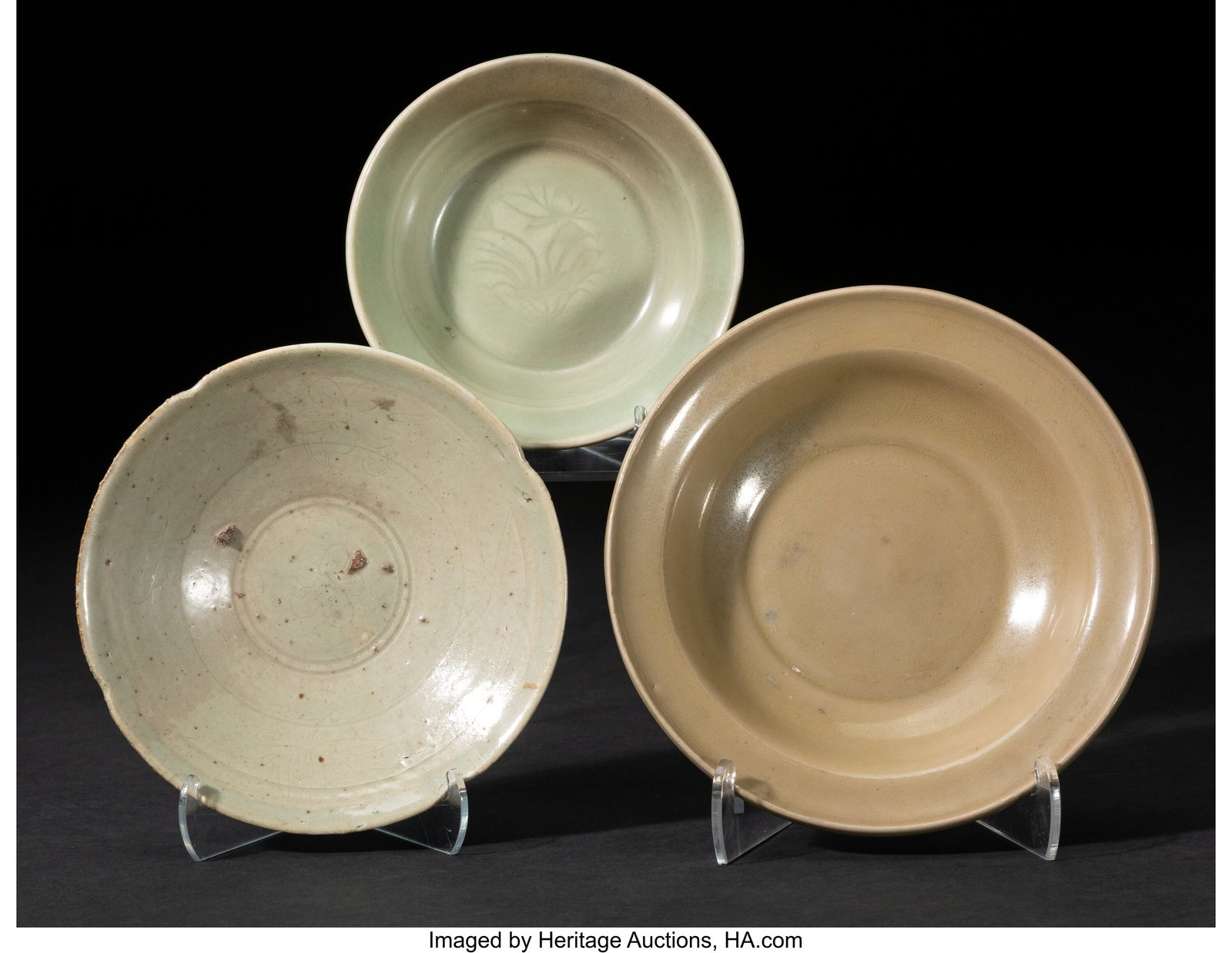 A Group of Three Asian Celadon-Glazed Dishes, 14: A Group of Three Asian Celadon-Glazed Dishes, 14th/15th century 1-5/8 x 6-3/8 inches (4.1 x 16.2 cm) (largest, diam.) Property from the